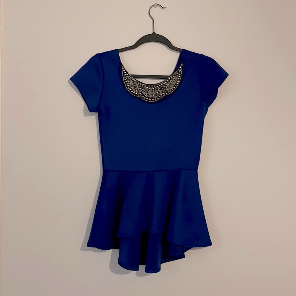 Blue (true blue color) peplum dressy top - size Small (I believe).